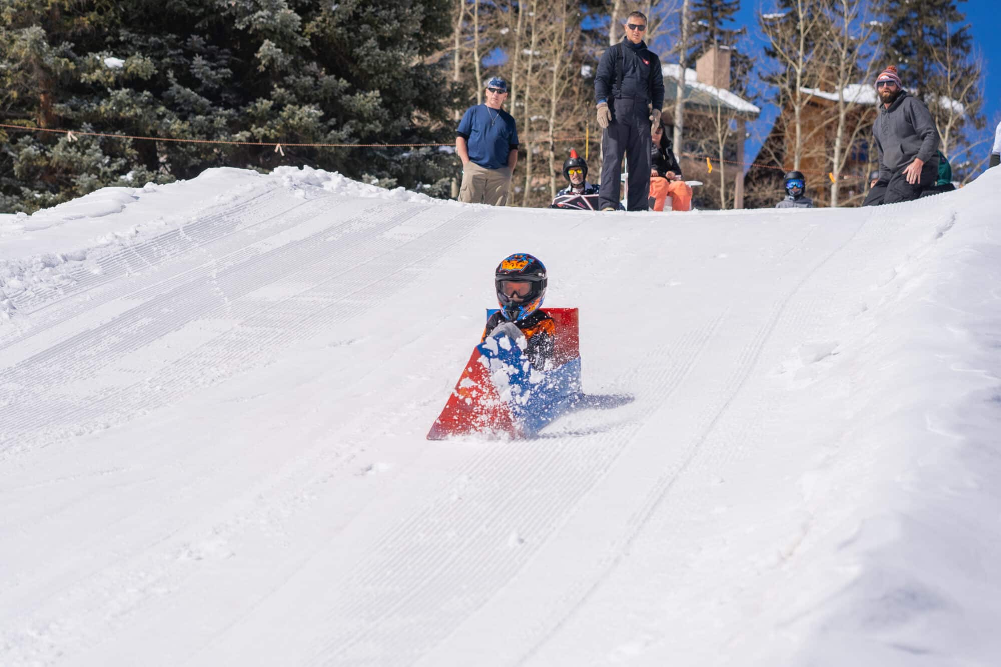 Kid going fast in cardboard derby