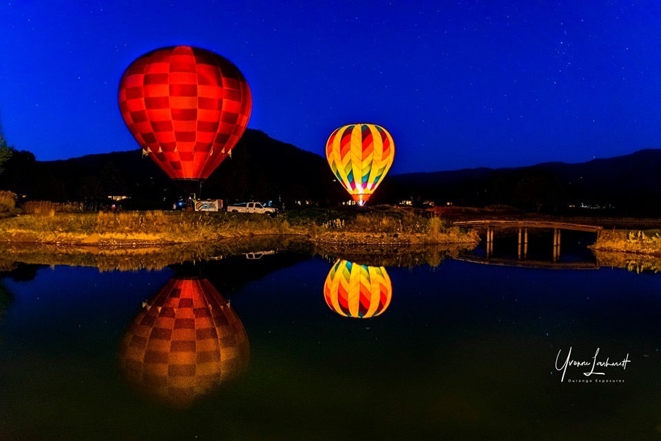 Hot air baloons glowing at night