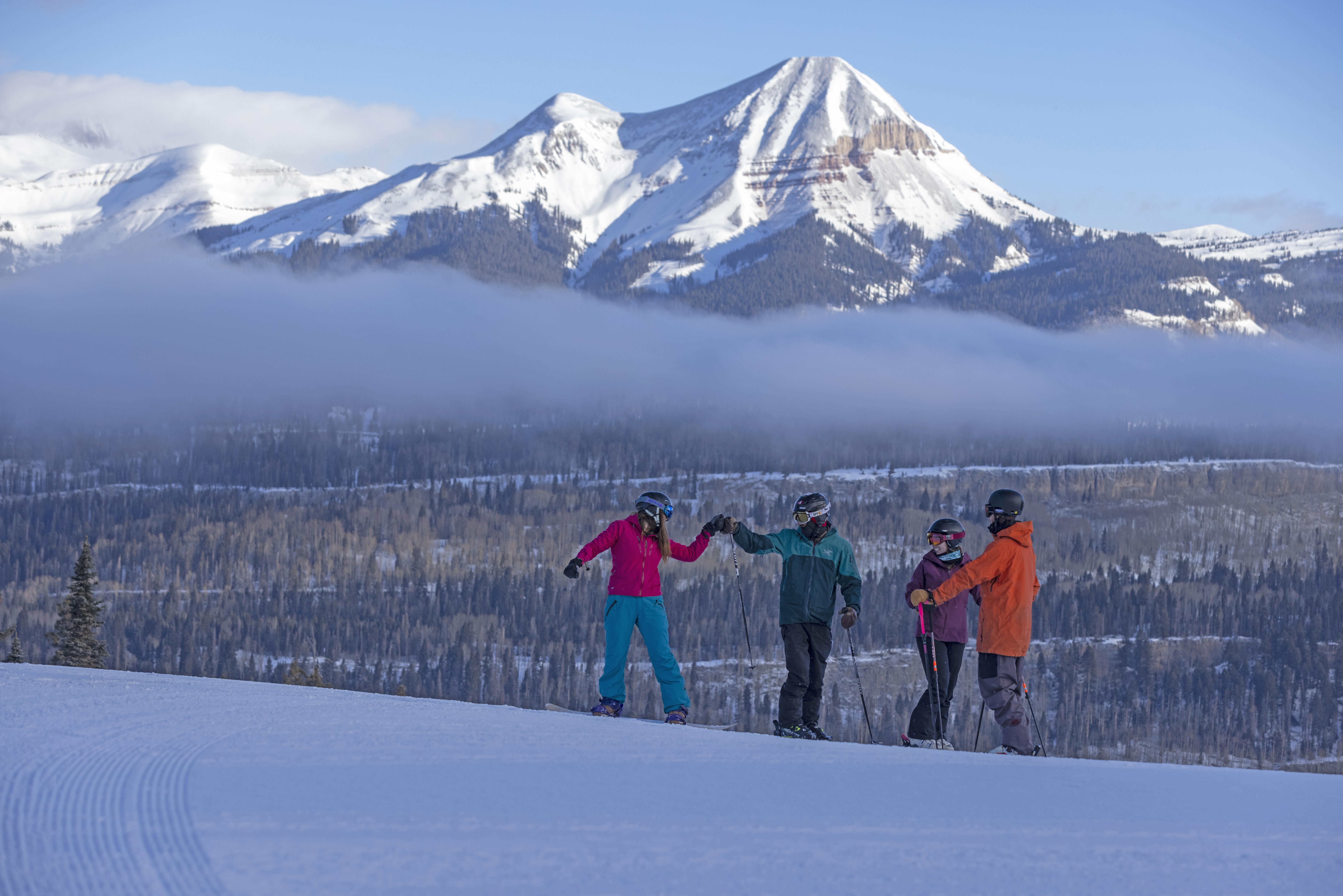 A group of skiers enjoying the views of the San Juan Mountains