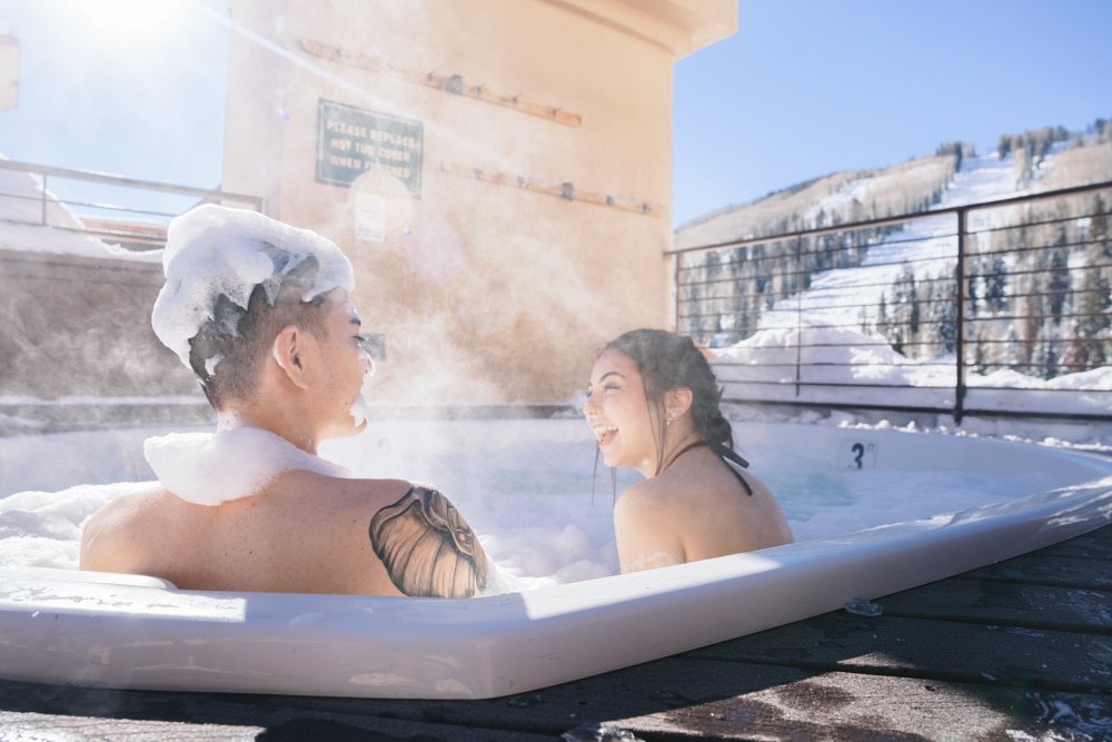 a couple enjoying a hot tub