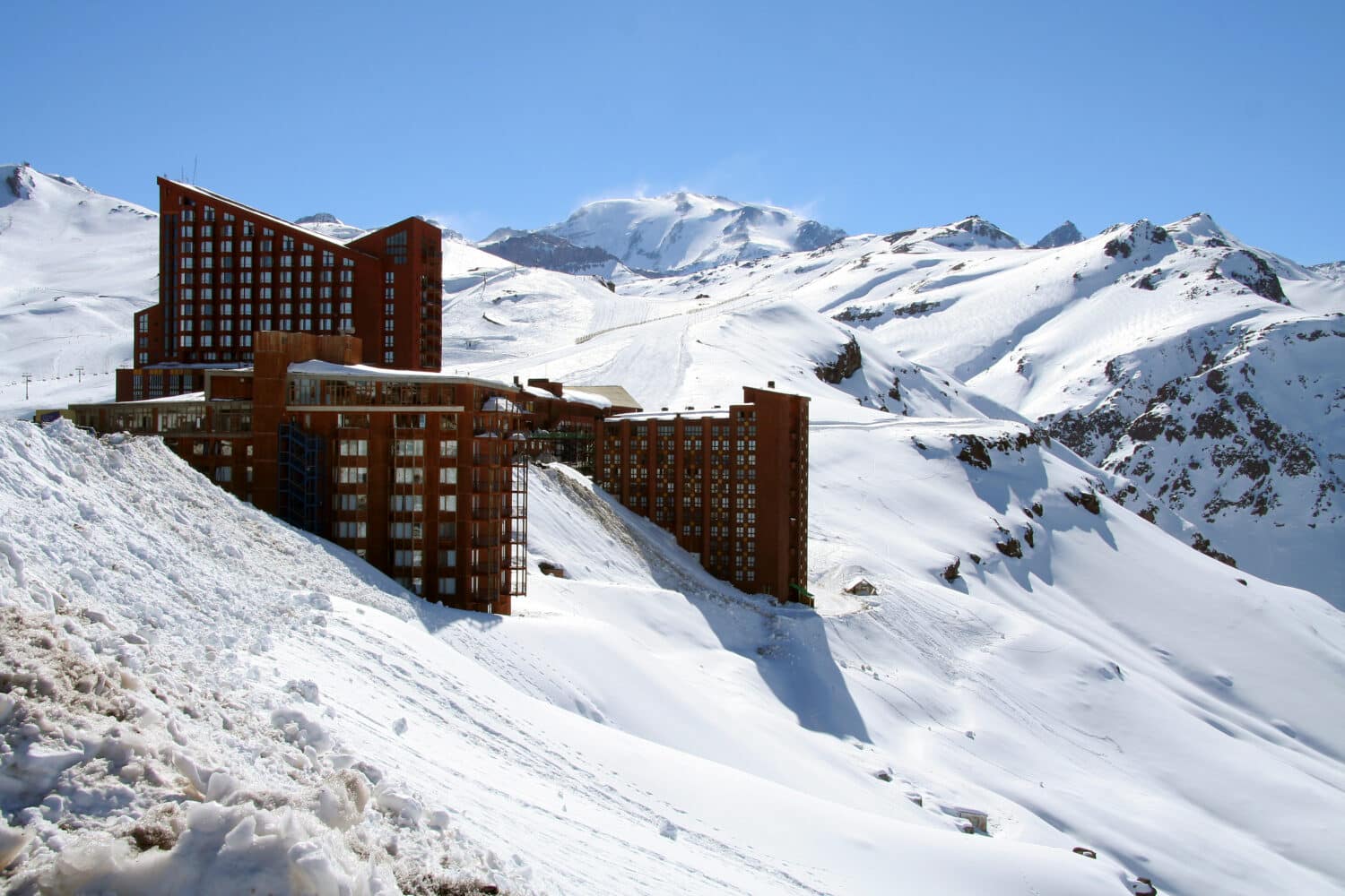 Big Brown hotels on the hillside of a big snow mountain