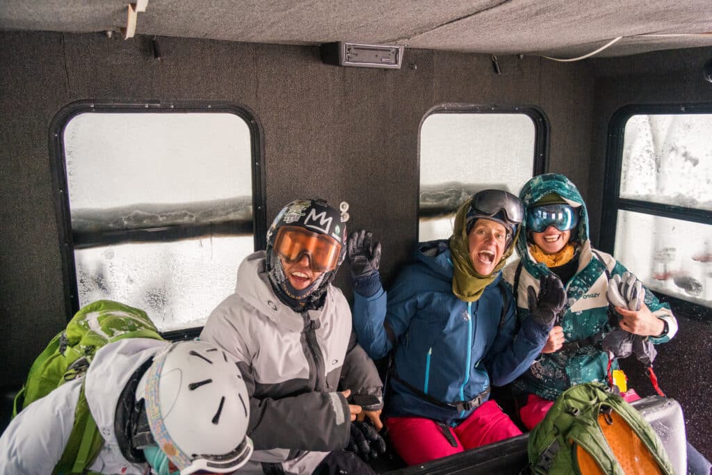 A group of people on the snowcat ride