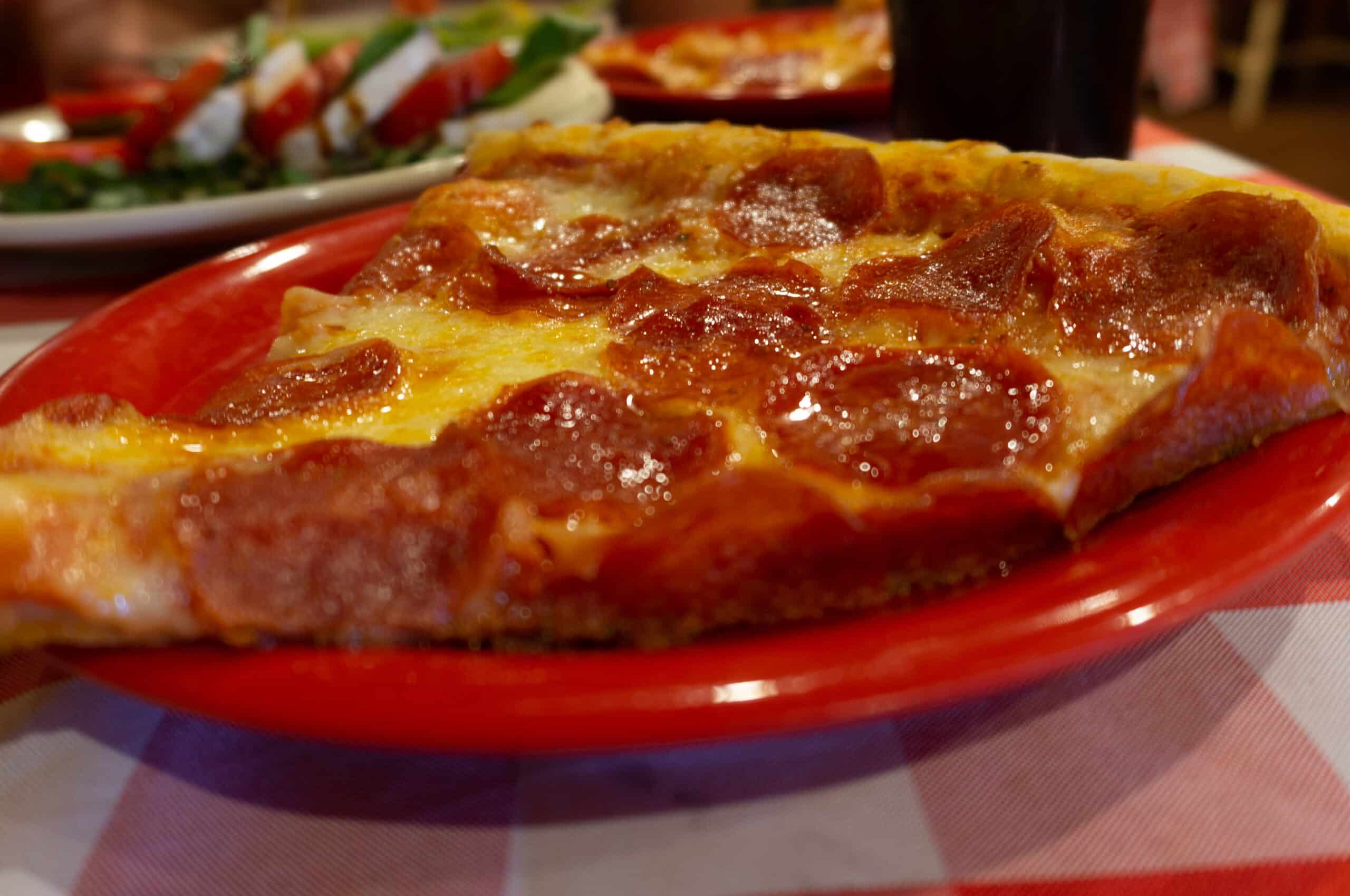 Pepperoni Pizza on a red and white checkered cloth