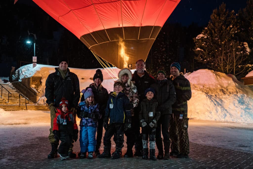 Family posing in front of Balloon glow