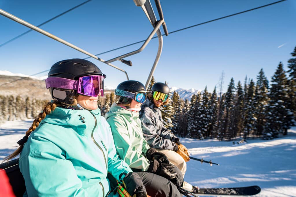 A group of skiers on chairlift