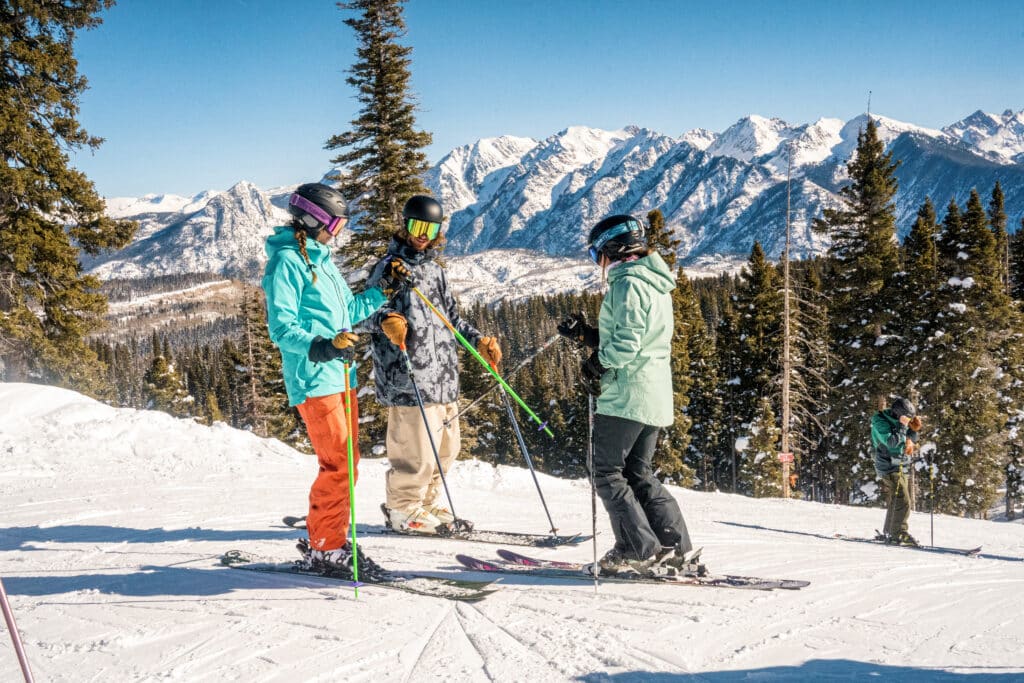 A group of skiers taking a break