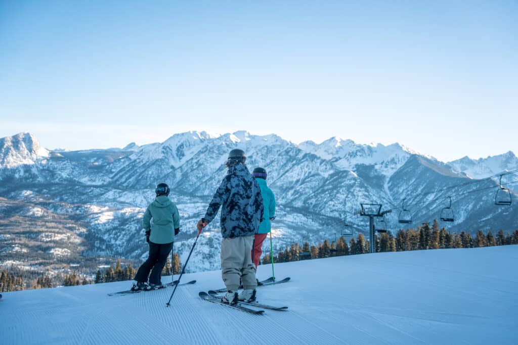 A group of skiers looking out at the breathtaking views