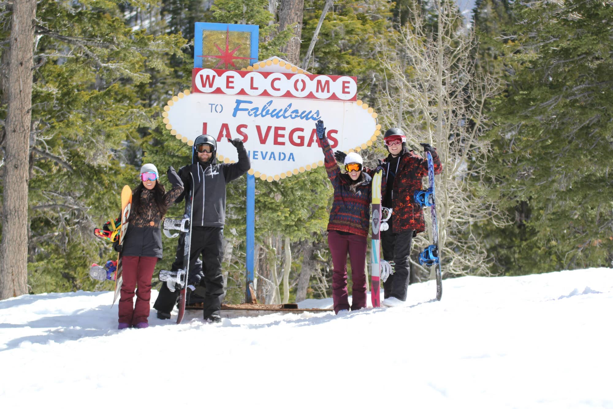 Group posing in front of Las Vegas sign