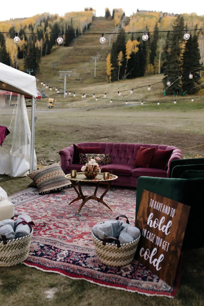 A wedding reception seating area on the beach outside Purgy's