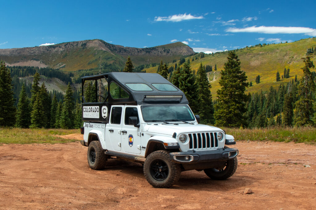 A white jeep in the mountains