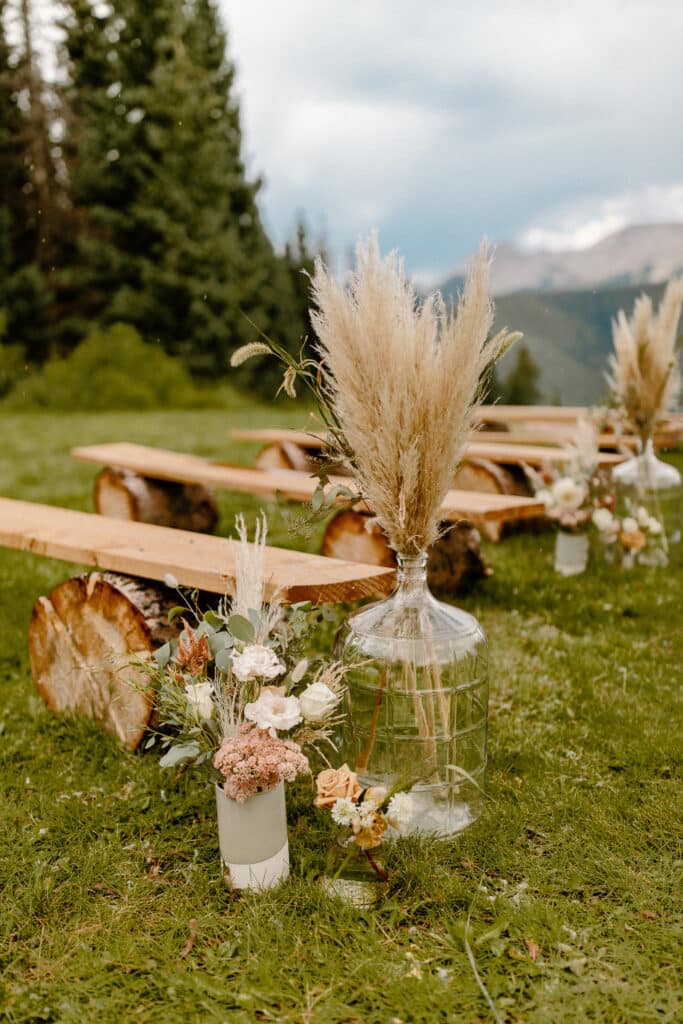 wood bench seating at an outdoor wedding ceremony site