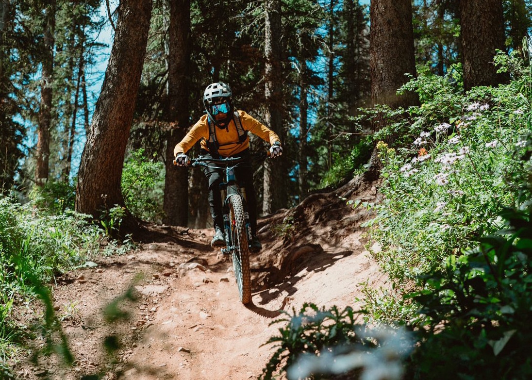 woman mountain biking at purg