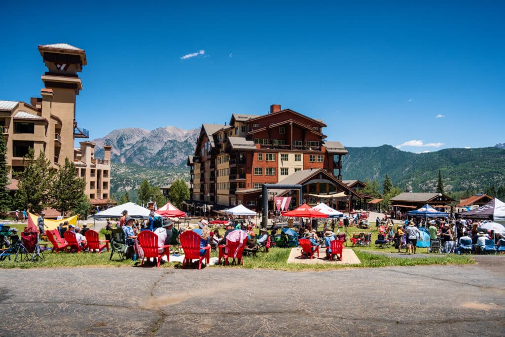 Guests hang out on the beach during annual brew festival
