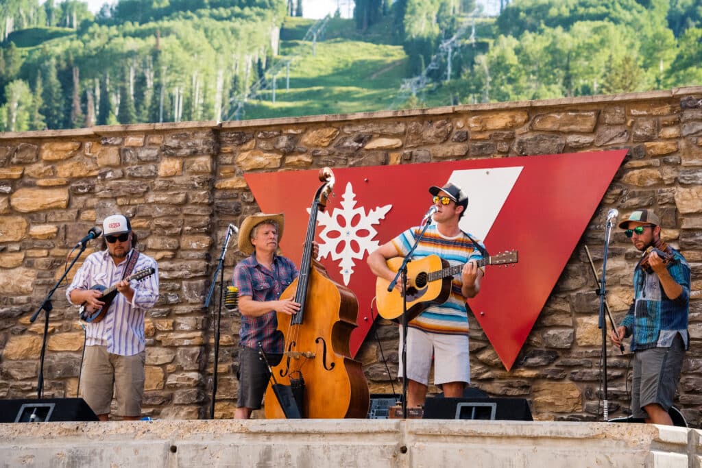A band plays live music in the plaza at Purgatory Resort