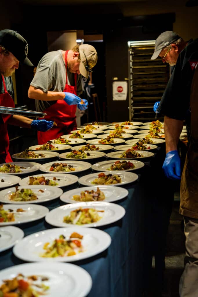 Chefs prepare plates at the Mushroom Dinner