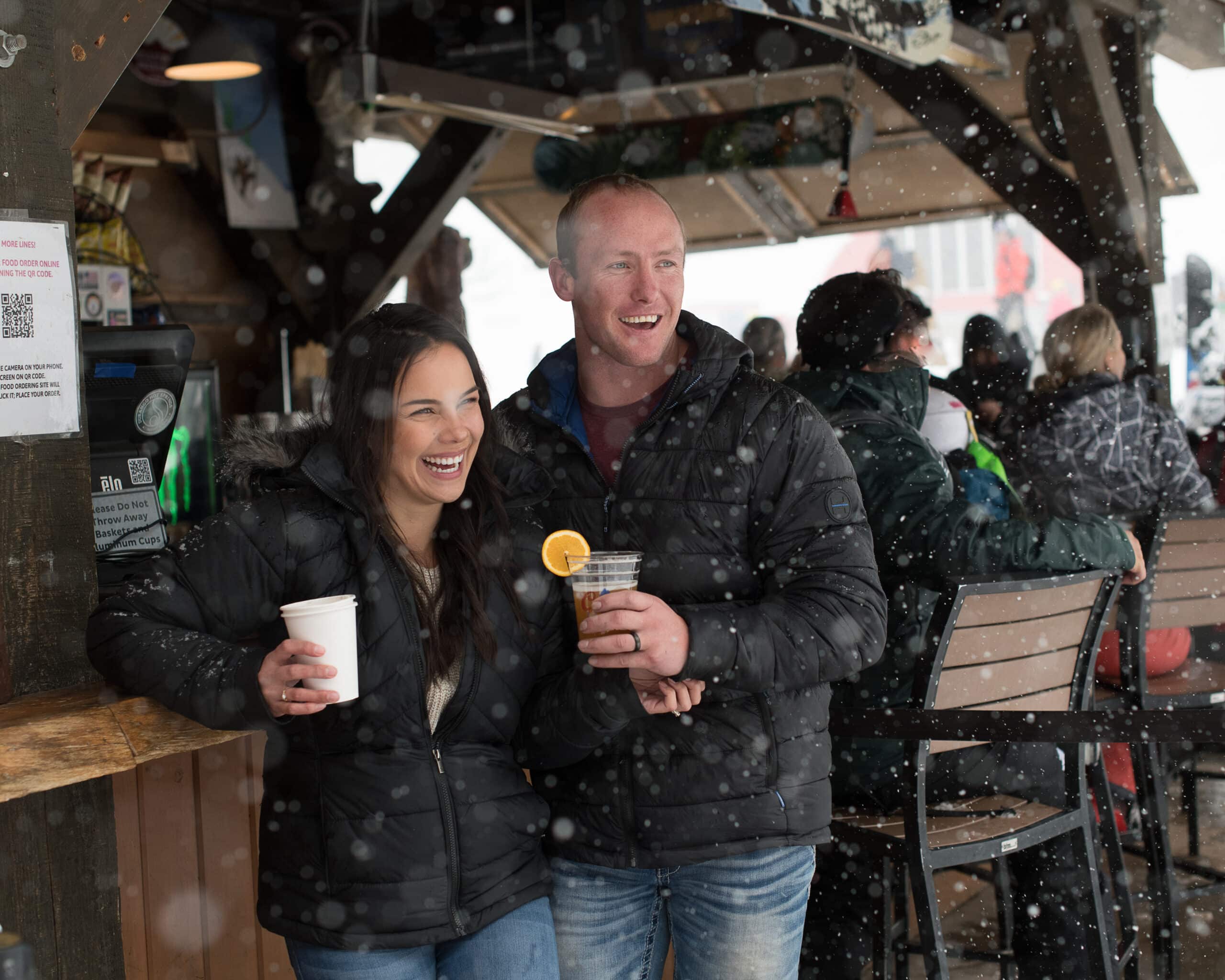 A couple enjoys a drink at Purgatory's Bear Bar