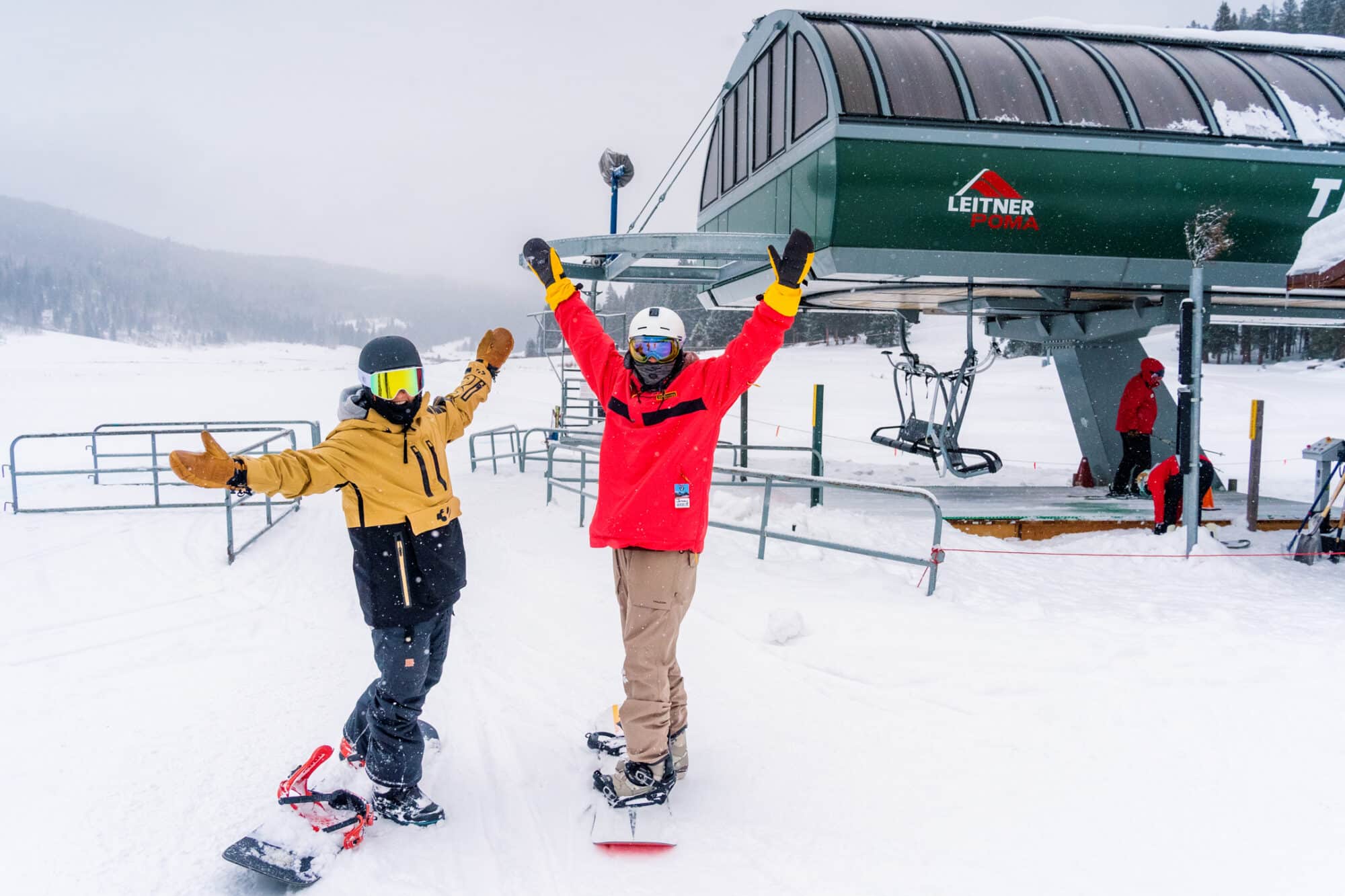 snowboarders at bottom of lift 8