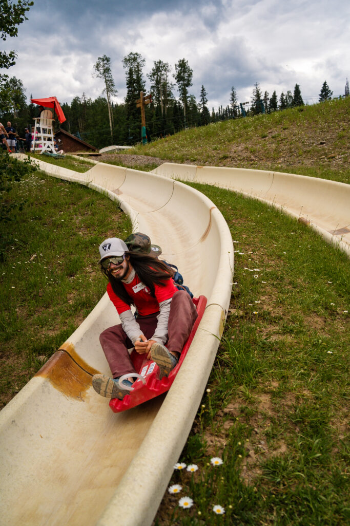 Purgatory employee rides down the Alpine Slide after his shift