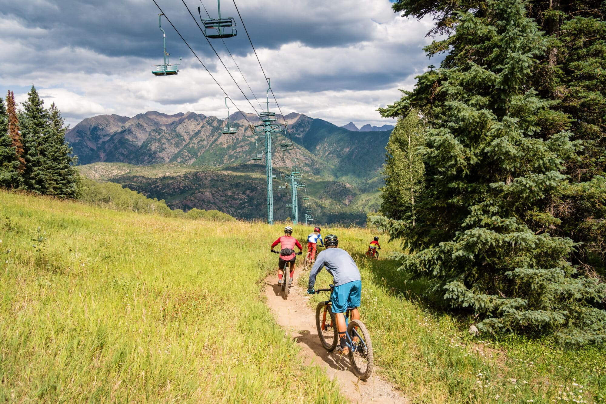 Family mountain bikes down the Purgatory Bike Park together