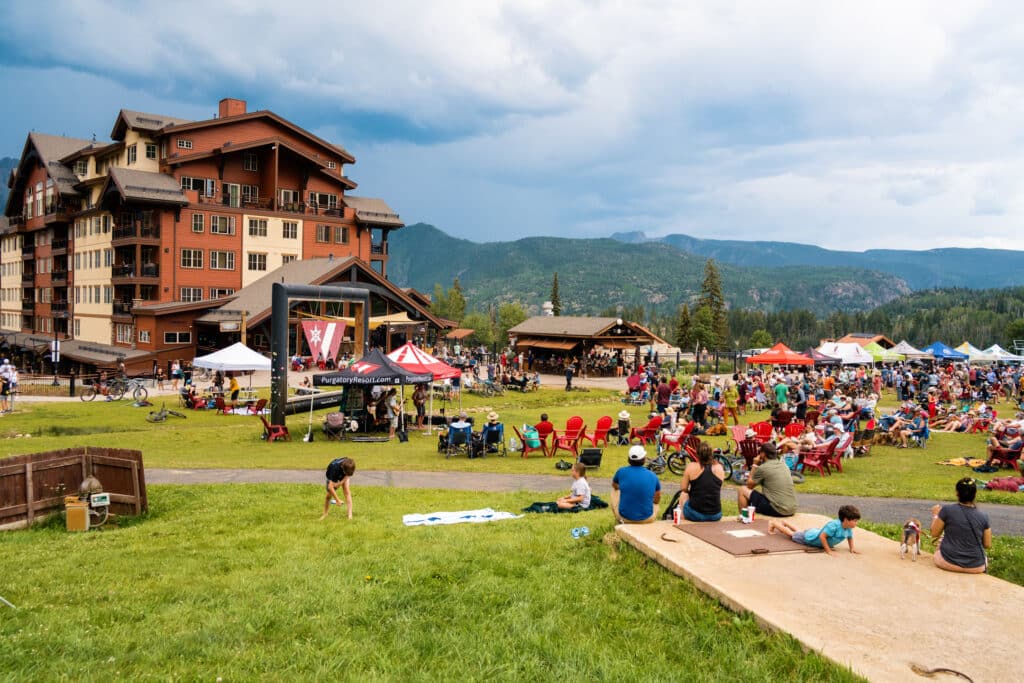 The beach at Purgatory Resort is full of people during summer brew 2024