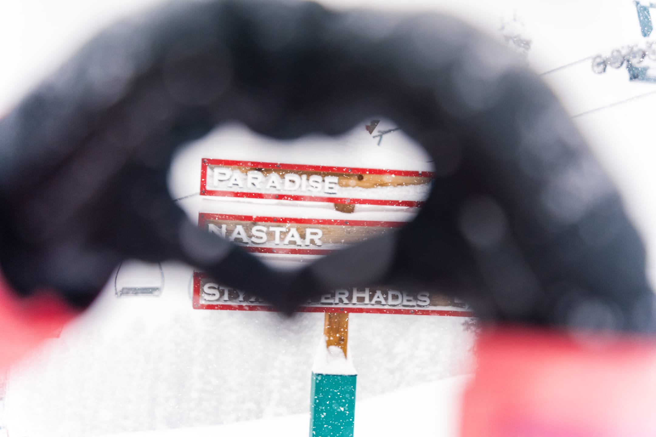 Hands make a heart on a powder day