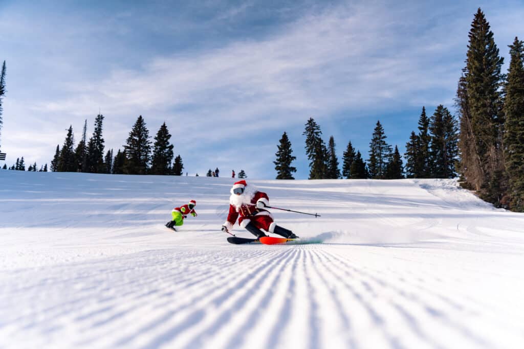 Santa and the Grinch ski down fresh groomers at Purgatory Resort