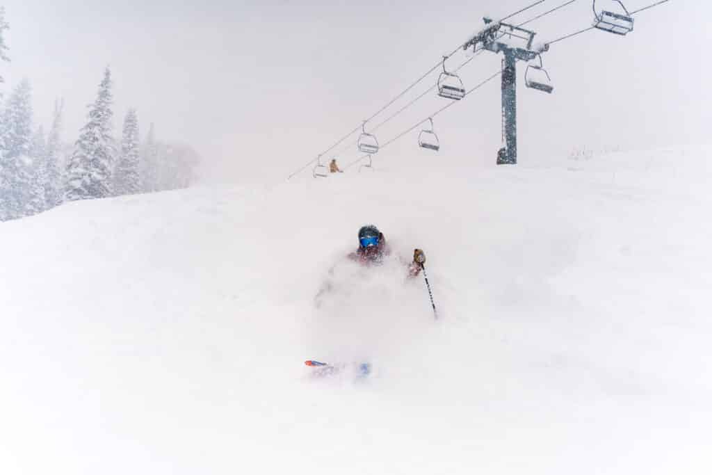 skiers rips down getting face shots in fresh pow