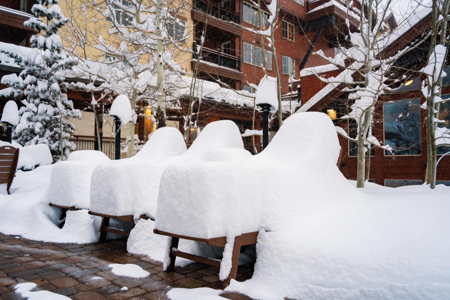 Snow piled insanely high on picnic table