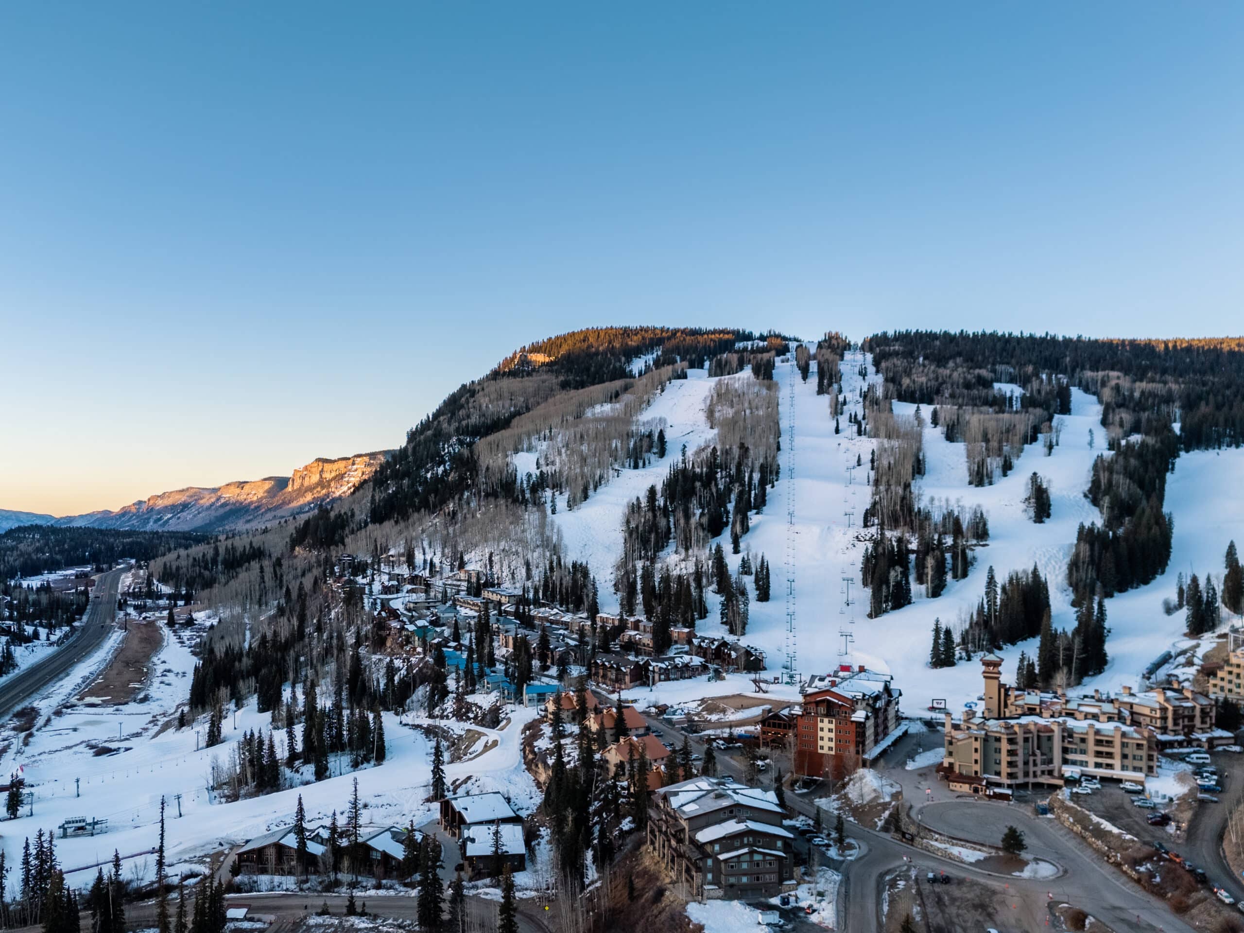 Sunrise drone shot of Purgatory's base area and mountain