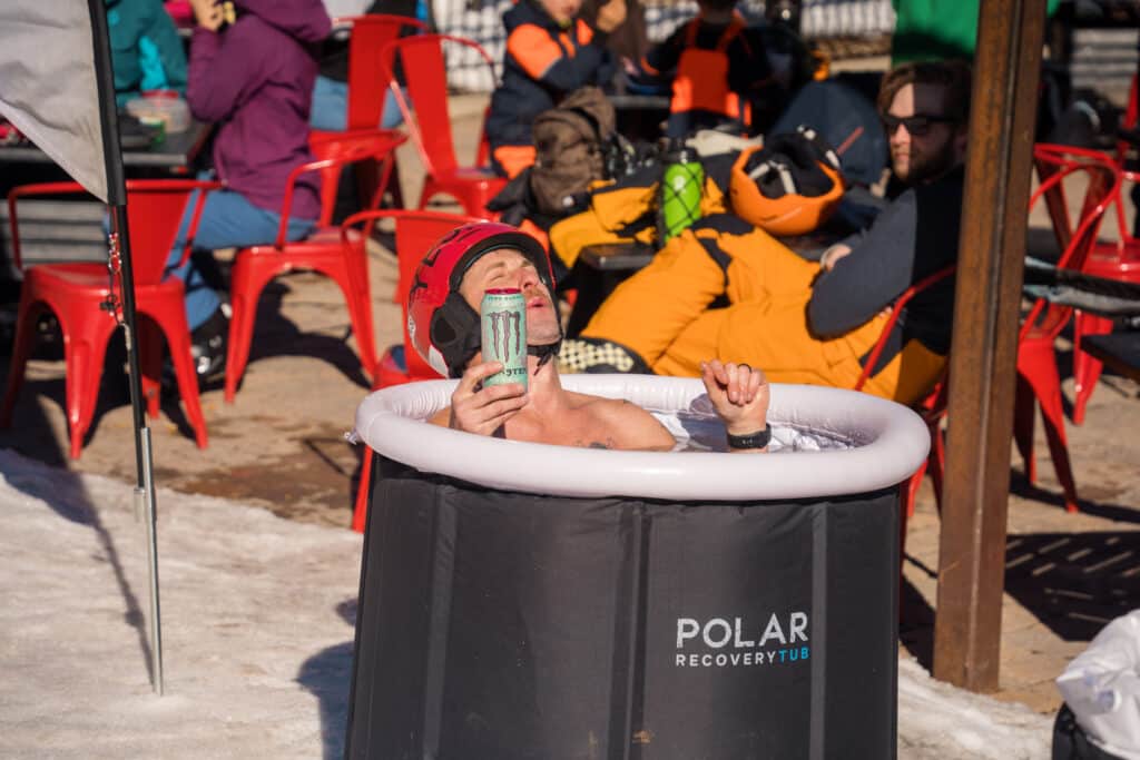 man braves an ice pool