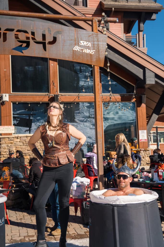 A viking woman proudly stands under Purgy's sign