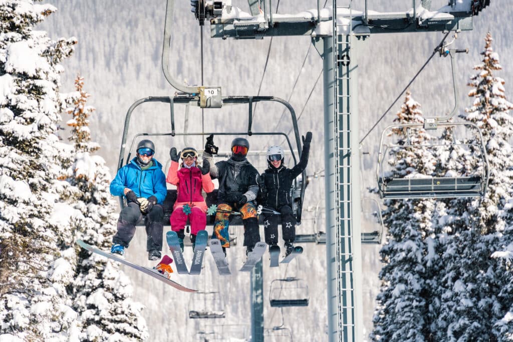 People cheer on lift and are so excited to ski!