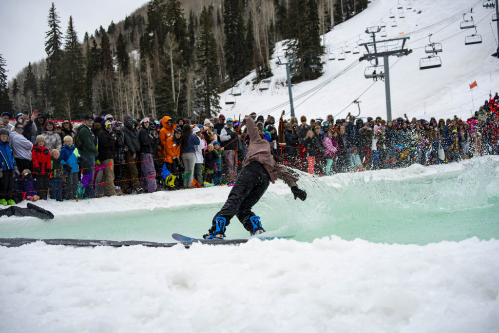snowboarder skims the pond and makes it!