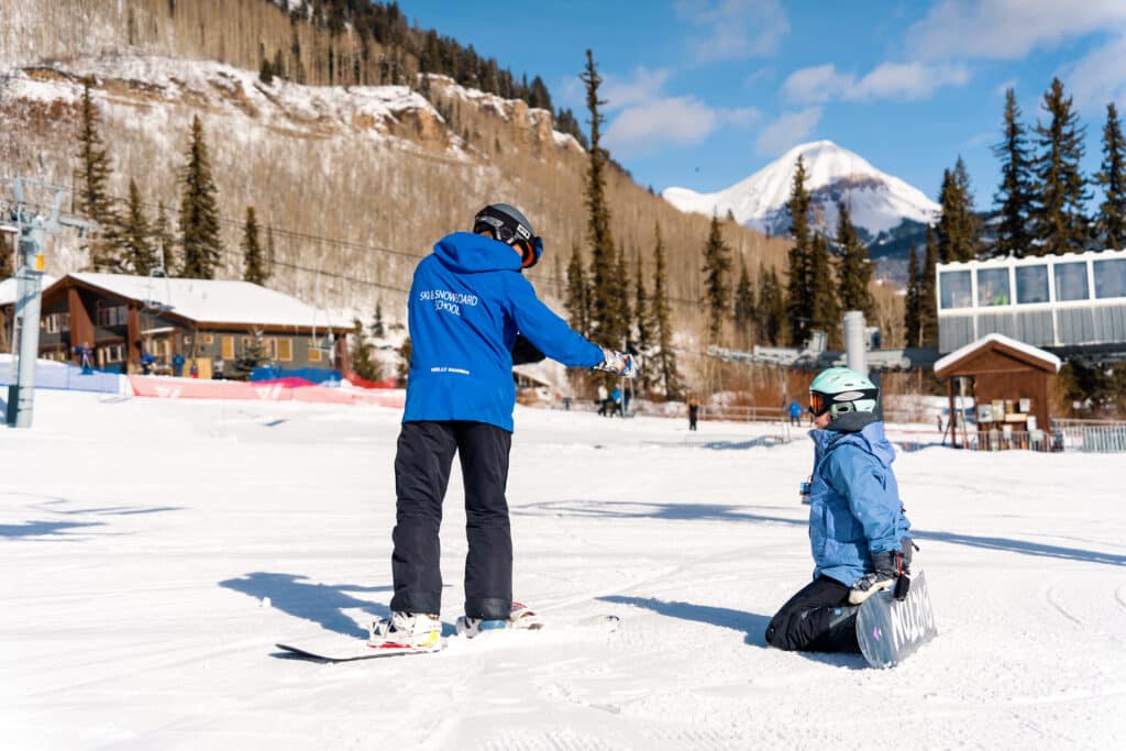 First-time snowboarder learns the basics in the free one hour beginner zone experience lesson