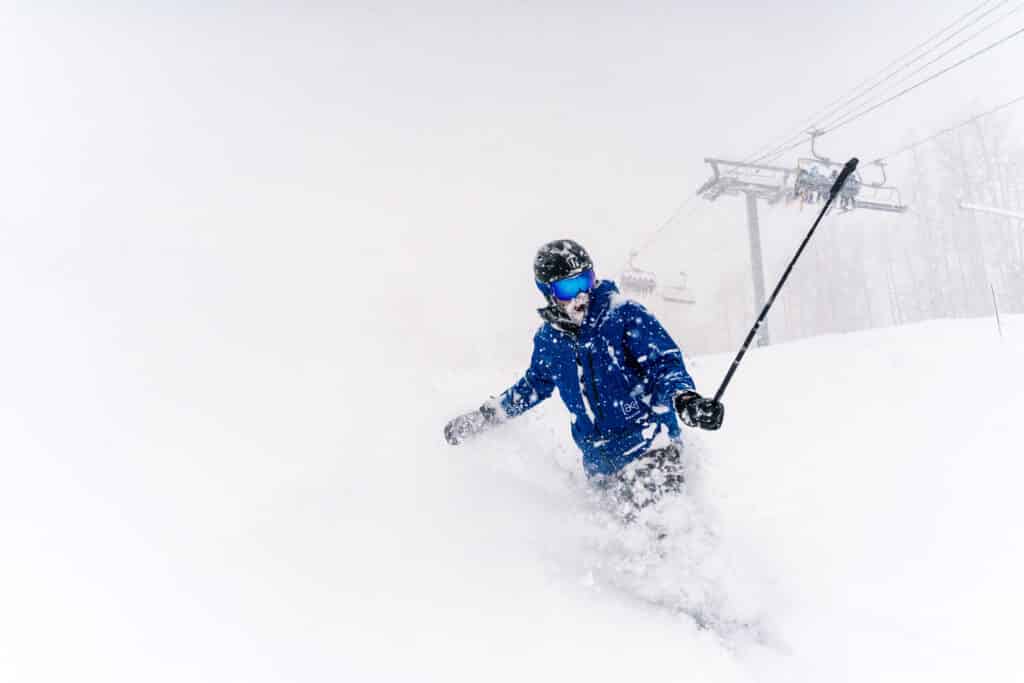 Snowboarder films himself surfing through powder at Purgatory Resort