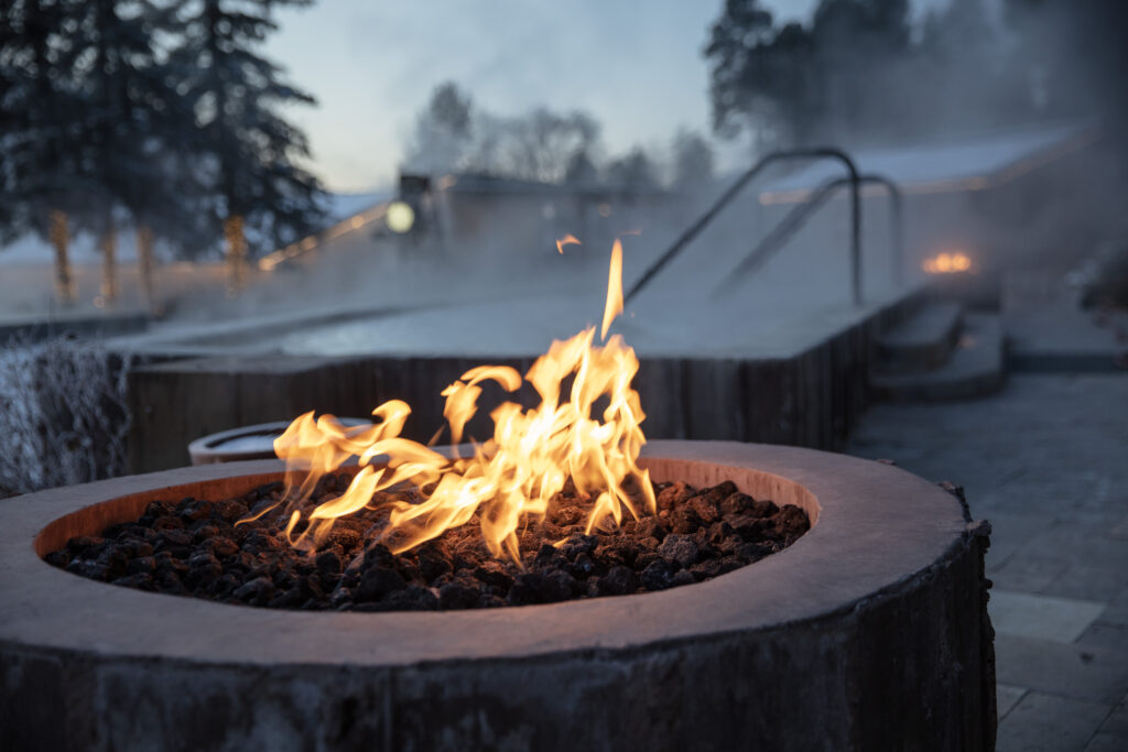 fire pit in front of soaking pool at Durango Hot Springs in the winter