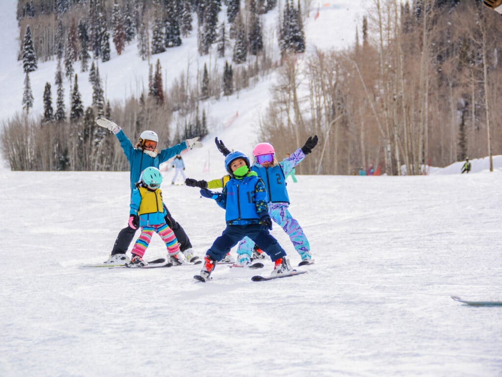 Rapid Images Photographer captures a ski school group having fun going down the mountain