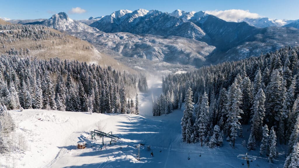 A drone view at the base of lift 2 as our snowmaking and grooming team works to open top-to-bottom skiing on Demon
