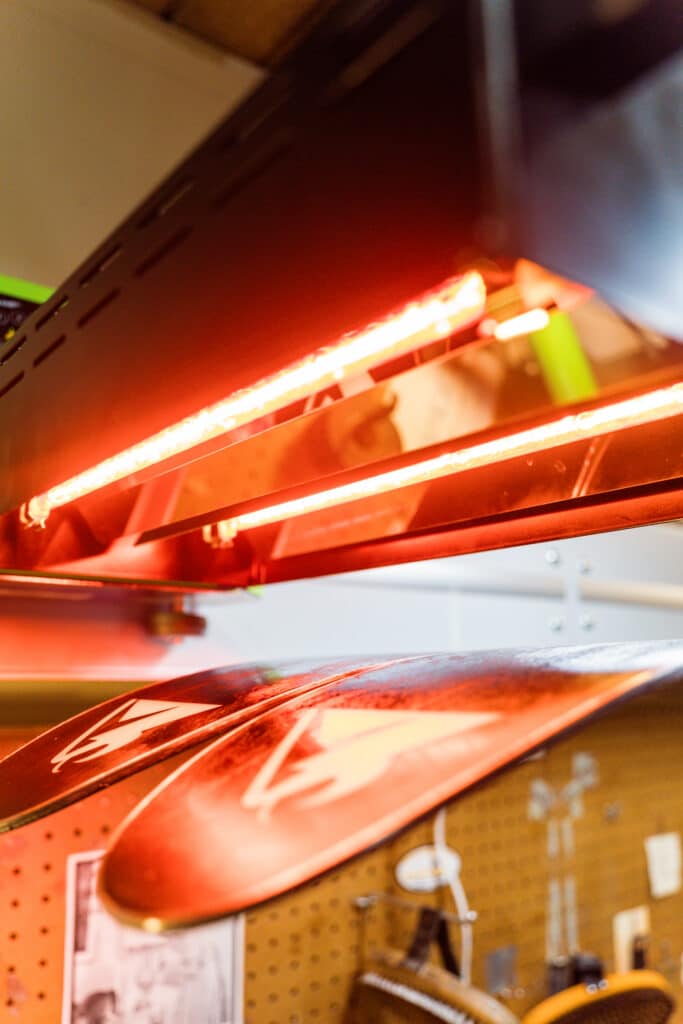 Techs at Expert Edge wax up a pair of skis